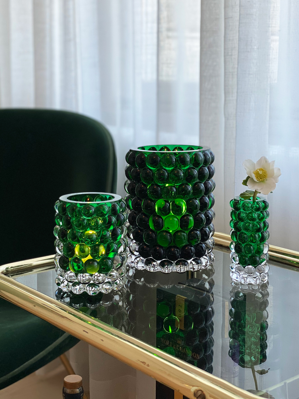 Hurricane Boule Lamps in green glass on glass table | Front of Sweden